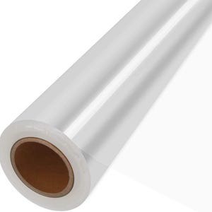 May include: A roll of clear, transparent plastic film. The film is tightly wound around a brown cardboard core. The plastic appears smooth and reflective, with visible light reflections. The overall appearance suggests a product for wrapping or packaging.