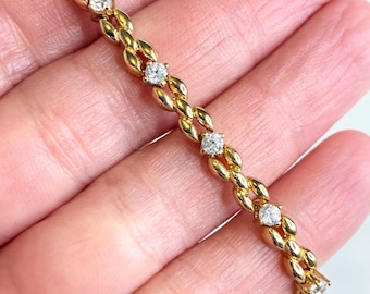 Bracciale tennis vintage color oro con maglie romane intrecciate e cristalli, 7,25"