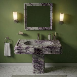 May include: A bathroom vanity set with a marble sink and matching mirror. The sink and mirror frame feature a purple and white veined pattern. The walls are painted a muted green, and the room is lit by sconces.