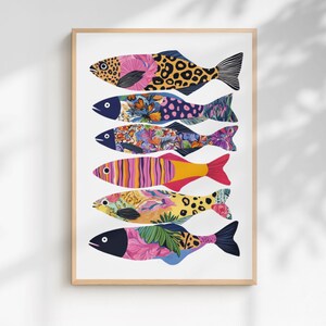 May include: A vertical art print featuring six stylised fish stacked in a column. Each fish displays a unique pattern, including leopard spots, floral motifs, and vibrant stripes in shades of pink, yellow, blue, and orange on a white background.