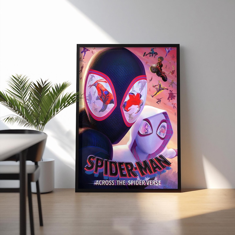 May include: Framed poster featuring Spider-Man and Spider-Gwen from the animated film "Spider-Man: Across the Spider-Verse." The poster has a black frame and displays vibrant colors. The title "Spider-Man" is prominently displayed, with the tagline "Across the Spider-Verse" below.