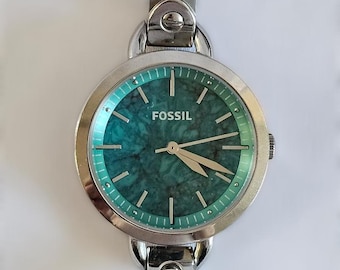 Reloj Fossil BQ3262 para mujer, con brazalete de acero inoxidable, esfera de mármol turquesa, movimiento de cuarzo y batería nueva.