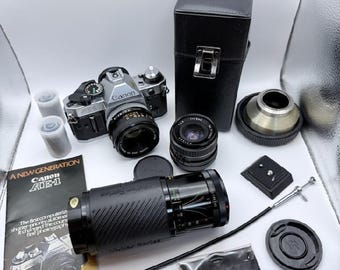 Canon ae-1 program 35mm slr film camera with extras