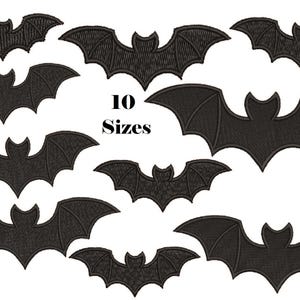 May include: A collection of ten black bat-shaped embroidery patches arranged in various sizes. Each patch features a detailed stitched texture with pointed ears and scalloped wings. The text 10 Sizes is printed in black in the center.