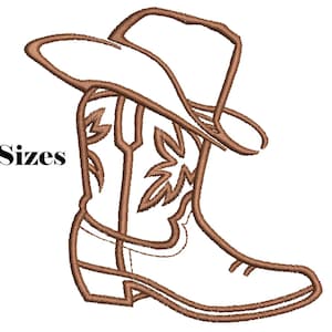 May include: An embroidered design featuring a cowboy boot and hat in shades of brown. The boot has a decorative floral pattern. The text "6 Sizes" is displayed in black. This design is suitable for embroidery projects.