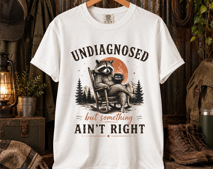 Undiagnosed- But Something Ain’t Right | Raccoon Sitting on Log Sarcastic T-shirt | Funny Wildlife Tee (Comfort Colors) 100% Cotton
