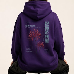 May include: A deep purple hooded sweatshirt featuring a graphic on the back with two red spider lily flowers. The design includes Japanese text, the English phrase "Archive / 07", and technical-style markings in a light blue and white color palette.