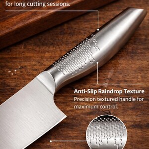May include: Close-up of a stainless steel chef's knife with an ergonomic curved handle. The handle has an anti-slip raindrop texture. The blade is made of premium stainless steel. Text on the image reads: "ERGONOMIC CURVED HANDLE" and "PREMIUM STAINLESS STEELBLADE".