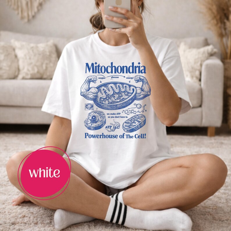 May include: White t-shirt with a blue graphic of a muscle-bound mitochondria, labeled with text. The text reads "Mitochondria Powerhouse of The Cell!" and includes diagrams of cell components.