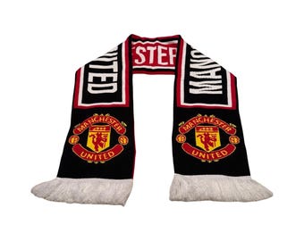 Bufanda de punto oficial vintage del Manchester United FC de 1997, roja, negra y blanca con flecos.