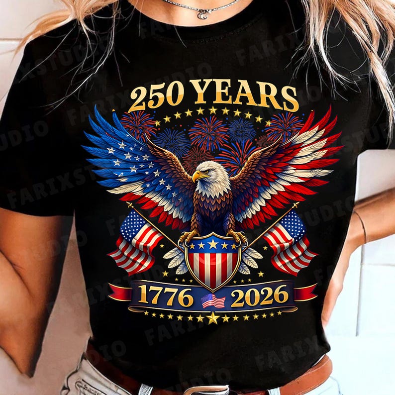 May include: Black t-shirt featuring a patriotic design with a bald eagle, American flags, and the text "250 YEARS 1776-2026". The eagle has red, white, and blue wings, and the design includes fireworks and a shield.