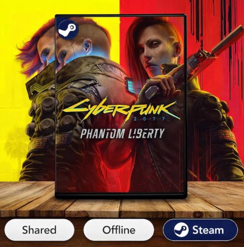 May include: A video game box for Cyberpunk 2077: Phantom Liberty. The cover art features a woman holding a gun, with a futuristic cityscape backdrop. The Steam logo is visible.