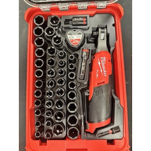 May include: A red Milwaukee M12 Fuel cordless ratchet tool set housed in a red plastic carrying case. The set includes a red and black power tool, numerous black metal sockets of varying sizes, a battery pack, and two extension bars.