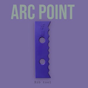 May include: A purple rib tool with the text "ARC POINT" in light green at the top and "Rib tool" at the bottom. The tool has a jagged edge and two circular holes.