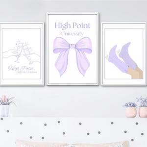 May include: Three framed art prints with a High Point University theme. One print shows champagne glasses clinking, another features a purple bow, and the third depicts legs wearing purple boots. The prints are in white frames.