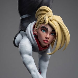 May include: A detailed figurine of a character with blonde hair styled in a high ponytail and a white hoodie with red accents. The figure is in a dynamic pose, with a black textured suit visible.