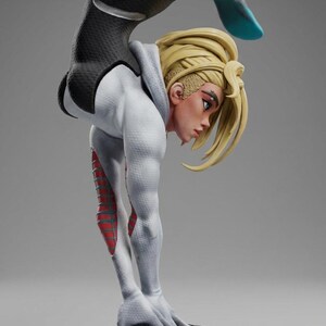 May include: A detailed figurine of a character in a dynamic pose, wearing a white and black suit with red accents. The figure has blonde hair and is positioned in a handstand, showcasing athletic form. The base is a textured, dark gray block.