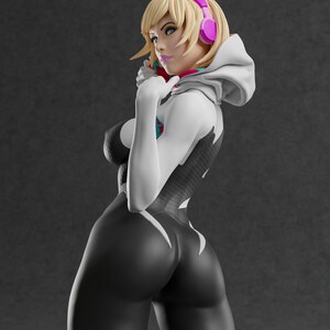 May include: A 3D-printed figurine of a female character in a black and white bodysuit with a spider-web design. She has blonde hair, blue eyes, and pink headphones. The figure is posed with one hand near her face.