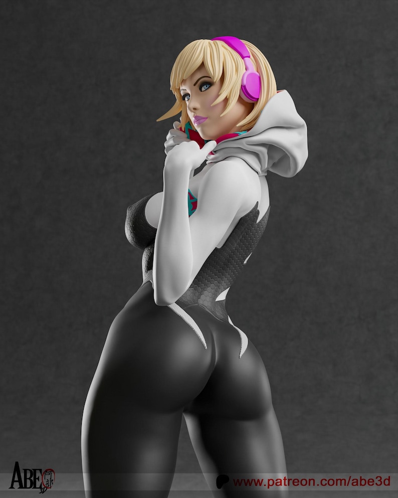 May include: A 3D-printed figurine of a female character in a black and white bodysuit with a spider-web design. She has blonde hair, blue eyes, and pink headphones. The figure is posed with one hand near her face.