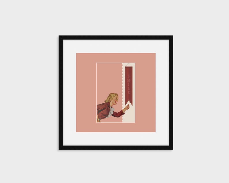 May include: A framed wall art print featuring a vintage-style illustration of a blonde person in a red jacket reaching toward a vertical maroon banner. The banner displays the word SMILE in light-colored capital letters against a dusty rose background.
