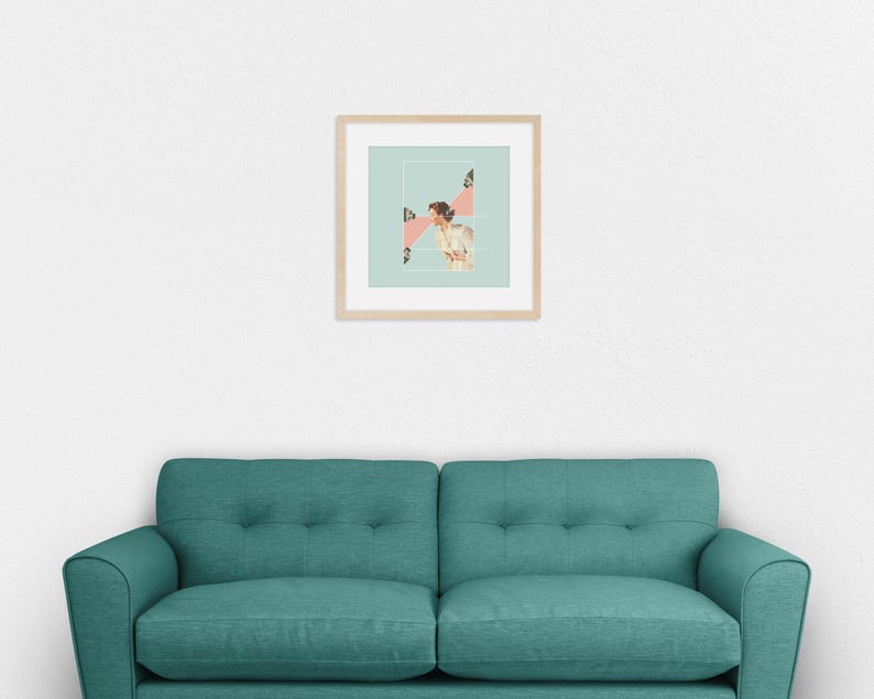 May include: A square framed wall art piece featuring a light green background with a central white rectangular border. Inside, a vintage-style illustration shows a person looking toward a pink geometric shape with small camera icons.