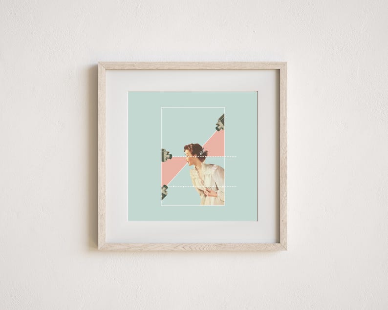 May include: A square framed art print featuring a collage of a person in a light-colored shirt centered within a pale green background. Three security cameras are positioned around the figure, with a pink triangular shape and white dotted lines.