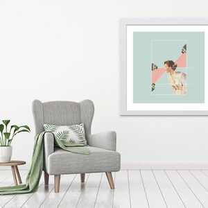 May include: A framed wall art print featuring a collage of a person in a light-colored shirt facing three cameras. The artwork is set against a pale green background with a pink triangular shape highlighting the interaction between the subject and cameras.