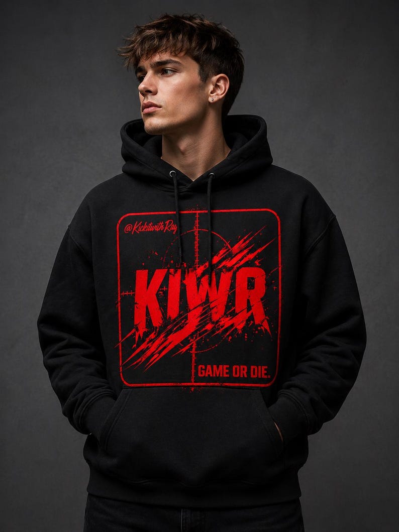 May include: Black hoodie with a red graphic that says "KIWR" inside a red square with a crosshair design. The text "GAME OR DIE" is below the graphic. The hoodie has a drawstring hood and a front pocket.