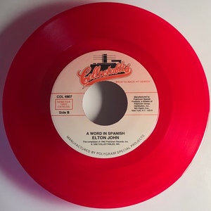Elton John - A Word In Spanish / Island Girl - 1992 Red Vinyl 45 - Mint