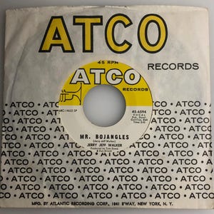 May include: A yellow and black vinyl record label with the text "ATCO RECORDS" in large, bold letters. The record label is for the song "Mr. Bojangles" by Jerry Jeff Walker. The record number is 45-6594.
