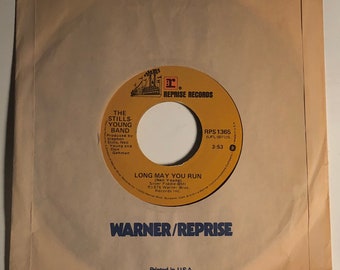 May include: A 7-inch vinyl record by The Stills-Young Band. The record is titled "Long May You Run" and is a Reprise Records release. The label is yellow with black text and a small logo of a ship.