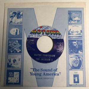 May include: A white vinyl record with a black label. The label has the text "M 1186F" and "MAYBE TOMORROW" in large, bold letters. The text "THE JACKSON 5" is printed in smaller letters below. The record is part of a larger album cover with the title "The Sound of Young America" printed in large, bold letters.