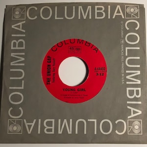 May include: A red and white vinyl record with the title "Young Girl" by The Union Gap featuring Gary Puckett. The record label is Columbia Records and the record number is 4-44450.