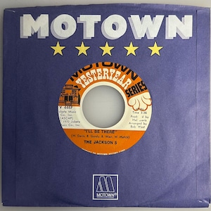 May include: A vintage Motown record sleeve in a deep blue hue, featuring the word "MOTOWN" in white block letters above five yellow stars. The record label reads "I'll Be There" by The Jackson 5.