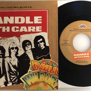 Voyager dans des Wilburys / À manipuler avec soin / George Harrison / Vinyle 45 avec PS / État neuf !