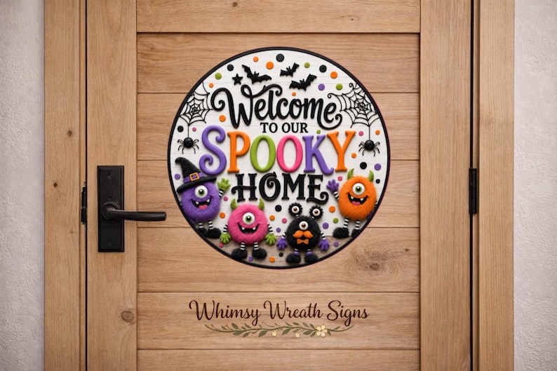 May include: A circular sign featuring the text Welcome to our SPOOKY HOME in black, purple, and orange lettering. The design includes four colorful monsters, black bats, and spider webs against a white background with orange and black polka dots.