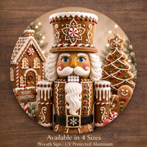 May include: A round Christmas wreath sign featuring a gingerbread nutcracker with a white mustache and blue eyes. A gingerbread house, Christmas tree, and gingerbread man are also visible. The sign reads "MERRY CHRISTMAS".