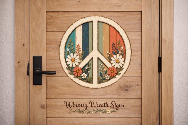 May include: A round peace sign with a colorful, vertical striped background, adorned with daisies and foliage. The sign is mounted on a wooden door. The text "Whimsy Wreath Signs" is at the bottom.