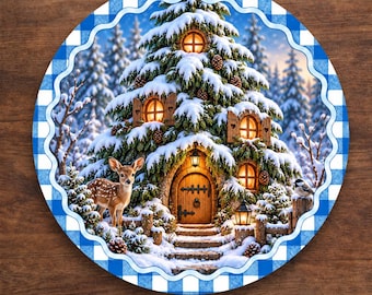 May include: A round aluminum wreath sign featuring a snowy evergreen tree house with glowing windows, a wooden door, and a deer in the foreground. The border has a blue and white buffalo check pattern. Text at the bottom reads: Available in 4 Sizes.