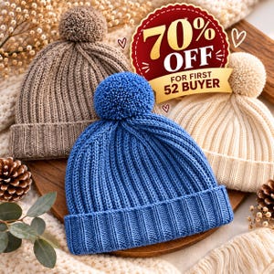 May include: Three knit beanies with pom-poms in blue, beige, and cream colors. Each hat features a ribbed texture and a folded cuff. A red and gold circular graphic overlay displays the text 70% OFF FOR FIRST 52 BUYER.