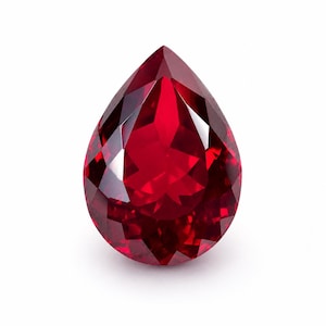 May include: A pear-shaped gemstone with a deep, vibrant red color and a faceted surface. The stone features a pointed top and a rounded base, with numerous triangular and diamond-shaped facets that reflect light to create a brilliant, sparkling appearance.