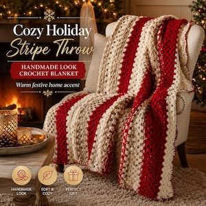 Puede incluir: Una manta de ganchillo con rayas verticales en colores alternos crema, beige y rojo oscuro. La manta está colocada sobre una silla e incluye el texto: Cozy Holiday Stripe Throw, HANDMADE LOOK CROCHET BLANKET, Warm festive home accent.