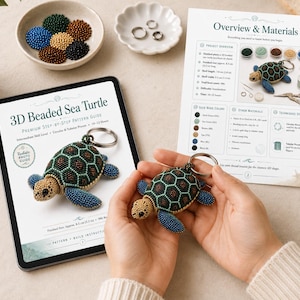 May include: A 3D beaded sea turtle keychain pattern guide on a tablet and printed paper, featuring a finished turtle with a green, brown, and blue beaded shell, a tan head with black spots, and a silver metal keyring. Includes bead colour lists.