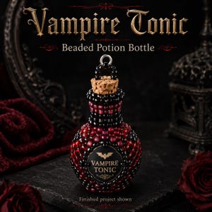 May include: A small potion bottle covered in black and deep red beads with a cork stopper and a silver metal loop at the top. A circular black label on the front features a gold bat icon and the text Vampire Tonic in gold lettering.