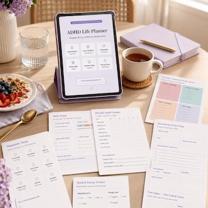 May include: A tablet displaying an ADHD Life Planner, surrounded by planning sheets, a journal, and a cup of tea. The tablet shows the text "ADHD Life Planner" and "Designed for how YOUR brain actually works."