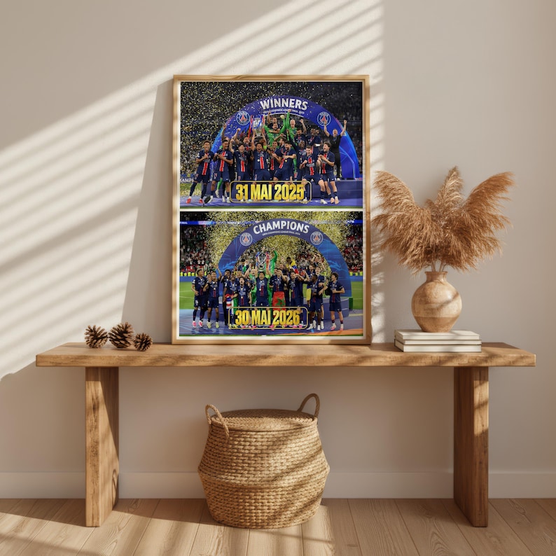 May include: A framed rectangular print featuring two stacked sports photographs of a football team celebrating under a blue archway. The top image displays the text WINNERS and 31 MAI 2025, while the bottom image displays CHAMPIONS and 30 MAI 2026 in yellow.