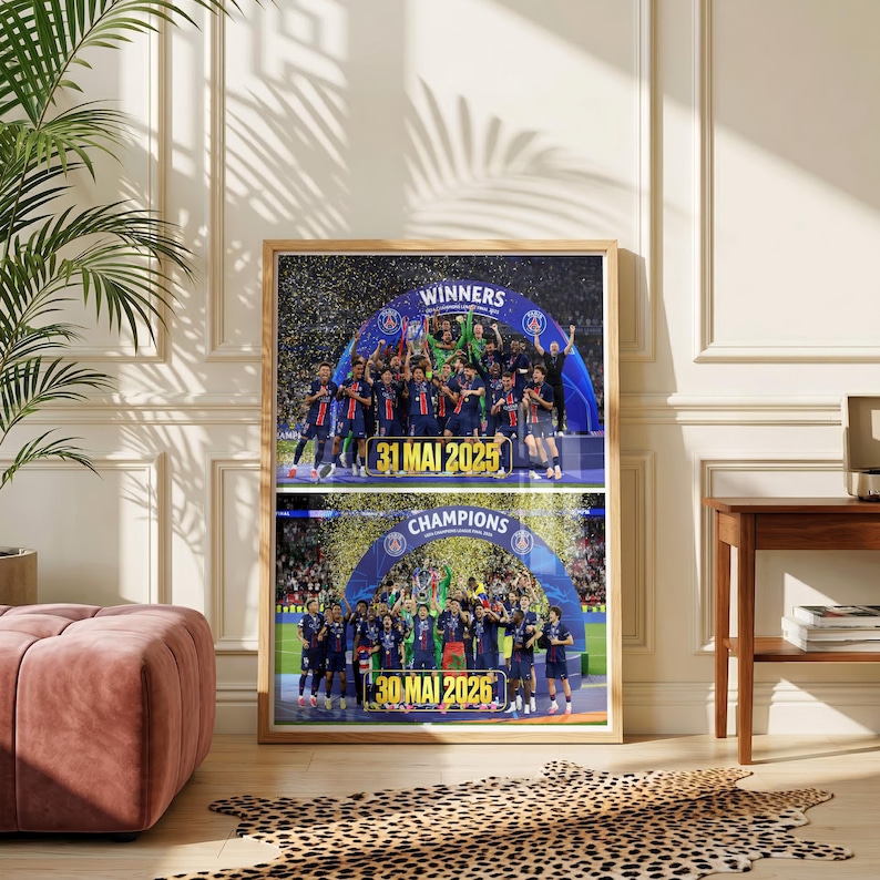 May include: A framed poster featuring two stacked photographs of a football team celebrating a victory under a blue archway. The top image displays the text WINNERS and 31 MAI 2025, while the bottom image displays CHAMPIONS and 30 MAI 2026.