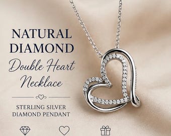 May include: A sterling silver double heart necklace featuring natural diamonds. The pendant consists of two interlocking heart shapes, one of which is encrusted with small round diamonds. The text reads NATURAL DIAMOND Double Heart Necklace.