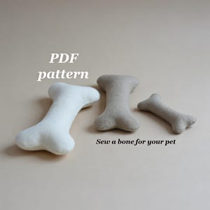 May include: Three plush dog bone toys in varying sizes. One is white, and the other two are beige. The text "PDF pattern" and "Sew a bone for your pet" are also visible.