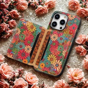 May include: A floral patterned phone case and wallet combo. The case and wallet feature a colorful design of flowers in shades of red, yellow, blue, and green. The wallet has card slots and a magnetic closure.